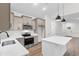 Modern kitchen featuring stainless steel appliances, sleek countertops, and a stylish center island with pendant lighting at 4650 Quiet Ave., Conway, SC 29527