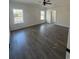 Spacious main bedroom with hardwood floors and large windows at 4650 Quiet Ave., Conway, SC 29527