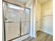Bathroom with glass door shower, window for natural light, and modern fixtures at 4963 Old Highway 90, Conway, SC 29526