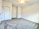 Spacious carpeted bedroom with a ceiling fan and closet, offering comfort and functionality at 4963 Old Highway 90, Conway, SC 29526