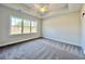 Bright bedroom with plush carpet, a ceiling fan, and a large window for ample light at 4963 Old Highway 90, Conway, SC 29526