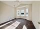Sunlit bedroom with a large window and plush carpeting, offering a bright and comfortable living space at 4963 Old Highway 90, Conway, SC 29526