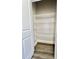 Walk-in closet featuring built-in wire shelving for organized storage and wood flooring at 4963 Old Highway 90, Conway, SC 29526