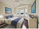Serene bedroom with a comfortable bed, bay window, and soft natural light, creating a relaxing atmosphere at 4971 Old Highway 90, Conway, SC 29526