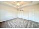 Bright bedroom featuring plush carpet, a modern ceiling fan, and plenty of natural light at 4971 Old Highway 90, Conway, SC 29526