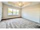 Bright bedroom with a large window providing great light and a neutral color palette at 4971 Old Highway 90, Conway, SC 29526