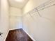 Walk-in closet with metal shelving and neutral carpeting; ready for organization and storage at 4971 Old Highway 90, Conway, SC 29526