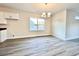 Bright dining area with elegant lighting fixture and natural light from the window at 4971 Old Highway 90, Conway, SC 29526