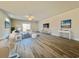 Open-concept living room with wood flooring, lots of natural light, stylish furniture and a sliding door to outside at 4971 Old Highway 90, Conway, SC 29526