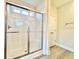 Modern bathroom shower featuring sliding glass doors and ample space inside the shower at 4971 Old Highway 90, Conway, SC 29526