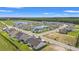 Aerial view of houses surrounding a pond at 1203 Cypress Shoal Dr., Conway, SC 29526