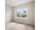 This bedroom with a window has carpeted floors and neutral walls at 1203 Cypress Shoal Dr., Conway, SC 29526
