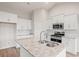 Bright kitchen with white cabinets, a granite island, and stainless steel appliances at 1203 Cypress Shoal Dr., Conway, SC 29526