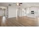 Open-concept living area with hardwood floors leading into the kitchen at 1203 Cypress Shoal Dr., Conway, SC 29526