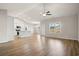 Spacious living room with hardwood floors and lots of natural light, open to kitchen at 1203 Cypress Shoal Dr., Conway, SC 29526