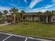 Exterior view of the community Amenities Center with well-maintained lawns and palm tree accents at 2207 Wood Stork Dr., Conway, SC 29526