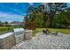 An outdoor kitchen and fire pit create the ideal backyard entertainment space at 2207 Wood Stork Dr., Conway, SC 29526