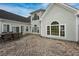 An inviting backyard boasts a brick patio and a beautiful view of the home at 2207 Wood Stork Dr., Conway, SC 29526