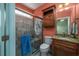 Bathroom with tiled shower, glass door, granite countertop vanity, and storage at 2207 Wood Stork Dr., Conway, SC 29526