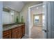 Bathroom with granite countertop vanity and view to adjacent bedroom with natural light at 2207 Wood Stork Dr., Conway, SC 29526