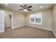 This bedroom features neutral walls, carpet floors, a ceiling fan, and a closet at 2207 Wood Stork Dr., Conway, SC 29526