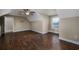 A cozy bedroom features hardwood floors, vaulted ceilings, a ceiling fan, and a window at 2207 Wood Stork Dr., Conway, SC 29526