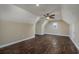 A cozy bedroom shows vaulted ceilings, wood floors, a ceiling fan, and a window at 2207 Wood Stork Dr., Conway, SC 29526