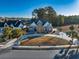 Stunning two-story home with a manicured front yard, circular driveway, and tasteful landscaping at 2207 Wood Stork Dr., Conway, SC 29526