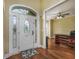 Welcoming foyer features a decorative front door, gleaming hardwood floors, and neutral paint at 2207 Wood Stork Dr., Conway, SC 29526