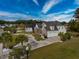 Charming home featuring a brick facade, pristine landscaping, and an inviting two-car garage at 2207 Wood Stork Dr., Conway, SC 29526