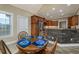 Cozy breakfast nook in kitchen with hardwood table, wooden chairs, and natural light at 2207 Wood Stork Dr., Conway, SC 29526