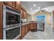 Well-lit kitchen featuring stainless steel appliances, granite countertops, and tile flooring at 2207 Wood Stork Dr., Conway, SC 29526