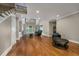 Spacious living room featuring hardwood floors, high ceilings, and ample natural light from large windows at 2207 Wood Stork Dr., Conway, SC 29526