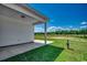 A covered back porch overlooks a spacious lot under a bright blue sky at 2682 Hugo Rd., Conway, SC 29527