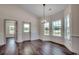 Formal dining room area featuring wood flooring, large windows, with decorative wall trim at 2682 Hugo Rd., Conway, SC 29527