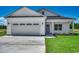 Charming single story home featuring an attached garage, green lawn, and traditional design elements at 2682 Hugo Rd., Conway, SC 29527