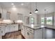 Modern kitchen with island, ample counter space, stainless appliances, pendant lights, and lots of storage at 2682 Hugo Rd., Conway, SC 29527