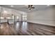 Bright living room featuring wood floors, recessed lighting, crown molding, and seamless transition to the kitchen at 2682 Hugo Rd., Conway, SC 29527