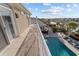 Scenic balcony view overlooking a sparkling pool, lush landscaping, and serene waterfront scenery at 3788 Waterford Dr., Myrtle Beach, SC 29577