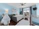 Charming bedroom with stylish decor, a comfortable bed, and a balcony overlooking the surrounding neighborhood at 3788 Waterford Dr., Myrtle Beach, SC 29577