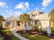 Beautiful home with manicured lawn, white tiled roof, and charming walkway at 3788 Waterford Dr., Myrtle Beach, SC 29577