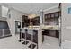 Spacious kitchen featuring dark cabinets, marble countertops, and a decorative chandelier above the island at 3788 Waterford Dr., Myrtle Beach, SC 29577