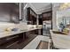 Modern kitchen with sleek dark cabinets, stainless steel appliances, and white backsplash and countertops at 3788 Waterford Dr., Myrtle Beach, SC 29577