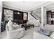 Comfortable living room featuring a large entertainment center and staircase at 3788 Waterford Dr., Myrtle Beach, SC 29577