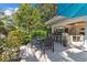 Charming outdoor dining area with a full dining set and an open bar, surrounded by lush greenery at 3788 Waterford Dr., Myrtle Beach, SC 29577
