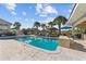 Inviting pool area featuring ample seating, lush landscaping, and a private retreat for relaxation and entertainment at 3788 Waterford Dr., Myrtle Beach, SC 29577