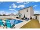 Nice in-ground pool with various patio furniture and an umbrella at 568 Affinity Dr., Myrtle Beach, SC 29588