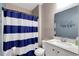 Bathroom featuring a blue and white striped shower curtain and modern vanity at 568 Affinity Dr., Myrtle Beach, SC 29588