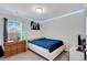 Well-lit bedroom with a queen-sized bed, carpet, and side tables at 568 Affinity Dr., Myrtle Beach, SC 29588