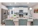 Kitchen island with bar stool seating, stainless steel appliances and granite countertops at 568 Affinity Dr., Myrtle Beach, SC 29588